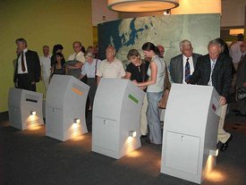 Exhibition visitors using the computer terminals of the interactive map of Europe. © Facts & Files